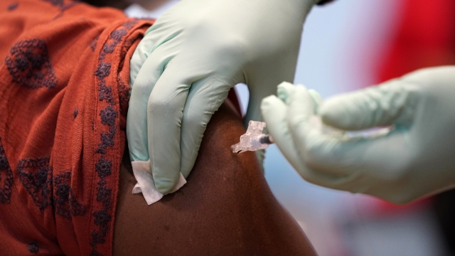 A Louisiana health care worker receives COVID-19 vaccine