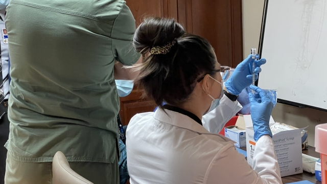 Hospital staff prepares doses of the Pfizer vaccine.