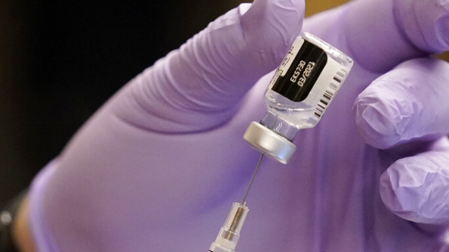 Pfizer-BioNTech Vaccine is prepared at Edward Hospital in Naperville, Ill.