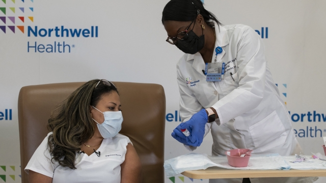 Arlene Ramirez, a nurse in New York, prepares to get the Moderna vaccine