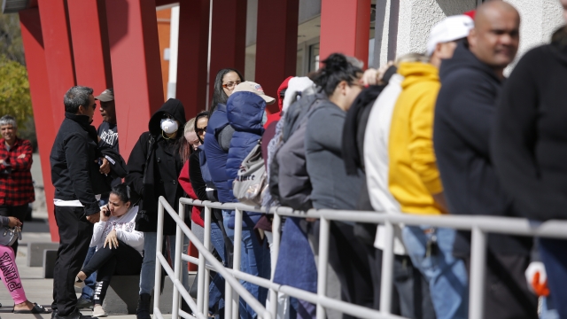 People wait in line for help with unemployment benefits at the One-Stop Career Center in Las Vegas.