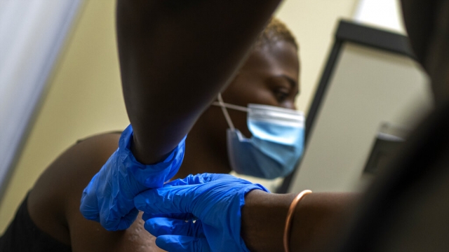 Thabisle Khlatshwayo, receives her second shot at a vaccine trial facility.