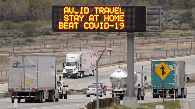 A sign along the interstate tells drivers to stay at home during the pandemic.
