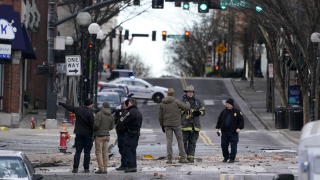 Emergency personnel work at the scene of an explosion in downtown Nashville.