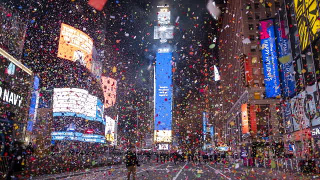 Confetti flies after the Times Square New Year's Eve Ball drops in a nearly empty Times Square