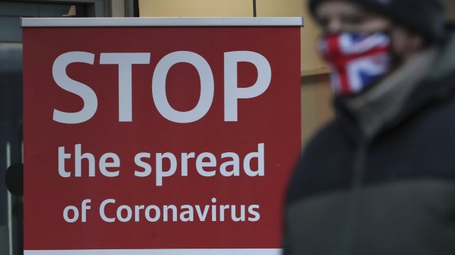 a coronavirus advice sign outside a bank in Glasgow the morning after stricter lockdown