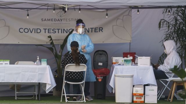 A PCR test is administered at a same-day coronavirus testing site in Los Angeles.