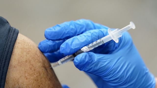 A healthcare worker receives a second Pfizer-BioNTech COVID-19 vaccine shot.