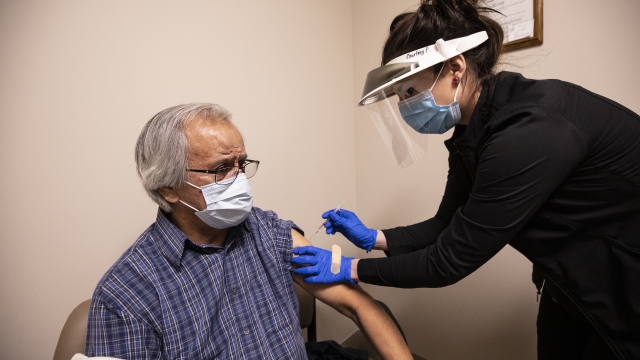 A fluent Cherokee speaker receives a COVID-19 vaccine.