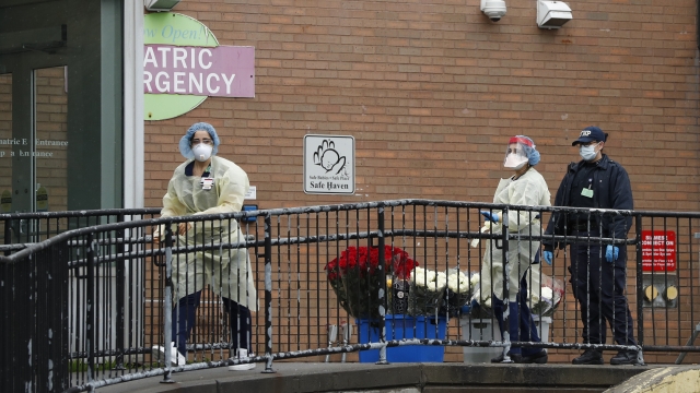 Emergency room nurses gather outside Elmhurst Hospital Center's after flowers were donated.