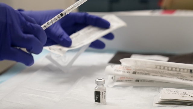 A pharmacist prepares Pfizer COVID-19 vaccinations