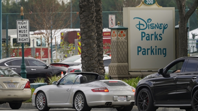 Vehicles queue up outside the Disneyland Resort parking lot for a COVID-19 vaccine