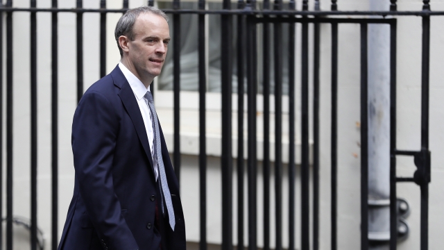 Britain's Foreign Secretary Dominic Raab walks down Downing Street