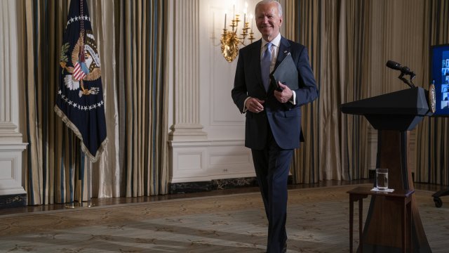 President Joe Biden leaves after attending a virtual swearing in ceremony