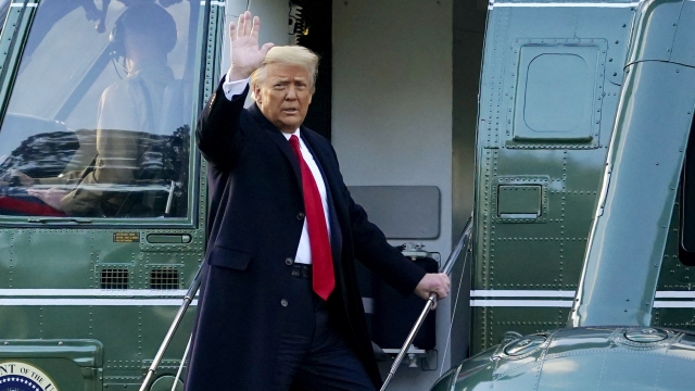 President Donald Trump waves as he boards Marine One