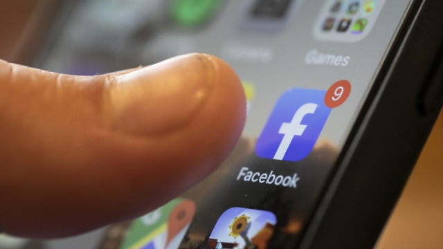 The Facebook app is displayed on the screen of a smartphone