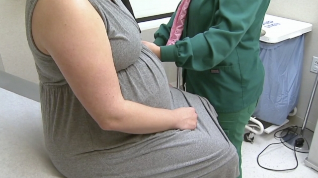 Pregnant women inside a doctor's office