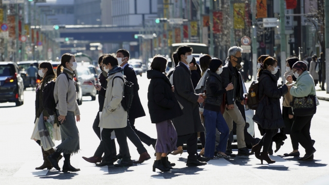 Citizens walking in Tokyo, Japan.