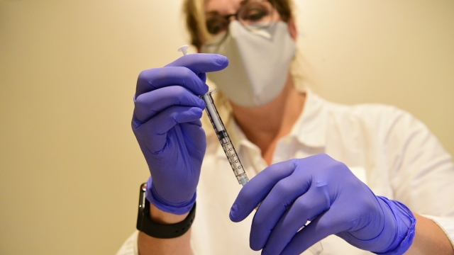 Johnson & Johnson shows a clinician preparing to administer investigational Janssen COVID-19 vaccine
