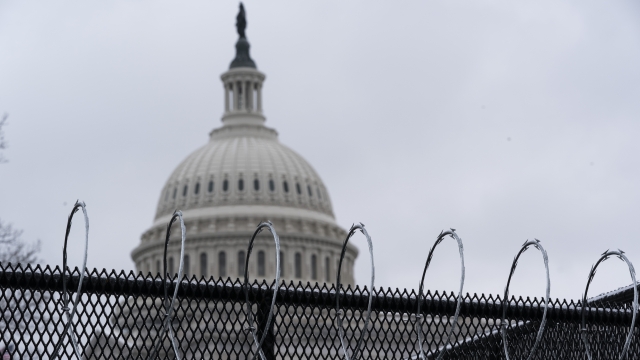 A temporary fence protects the U.S. Capitol.