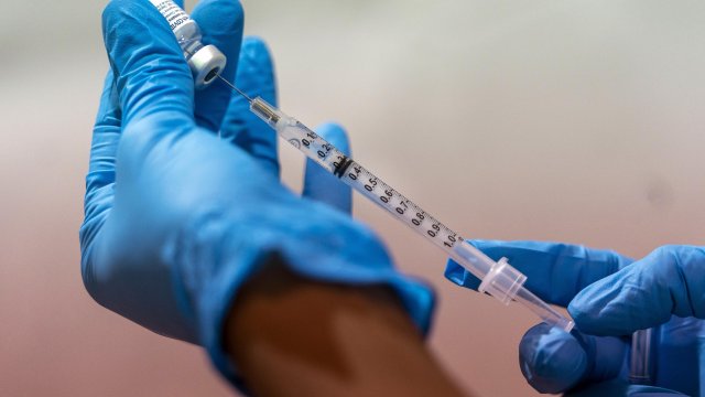 Person prepares vaccine
