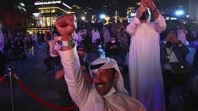 Emiratis celebrate after the Hope Probe enters Mars orbit as a part of Emirates Mars mission, in Dubai, United Arab Emirates
