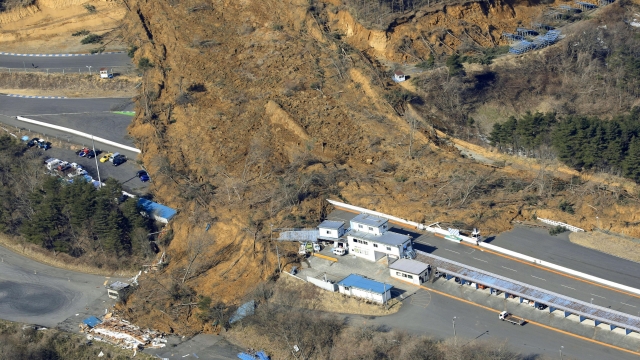 A landslide caused by a strong earthquake covers a circuit course in Nihonmatsu city, Fukushima