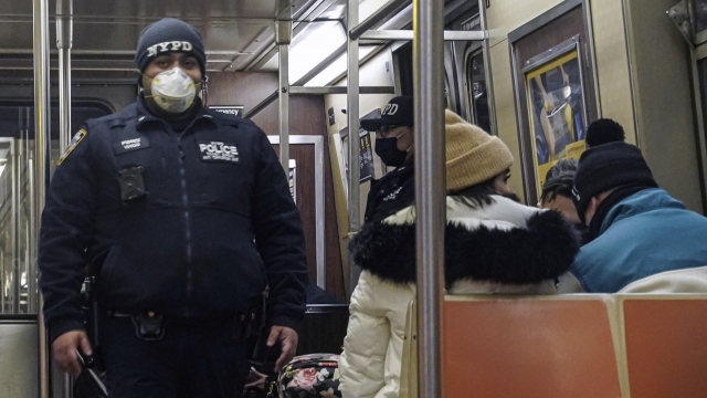 Police patrol the A line subway train bound to Inwood, after NYPD deployed an additional 500 officers into the subway system.