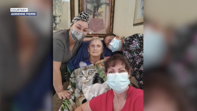 Woman poses with her sick mother.