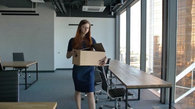 Woman carries a box