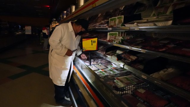 Grocery store worker in the dark in Dallas