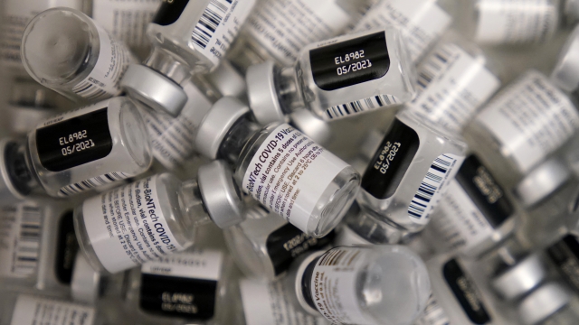 Empty vials of the Pfizer-BioNTech COVID-19 vaccine are seen at a vaccination center