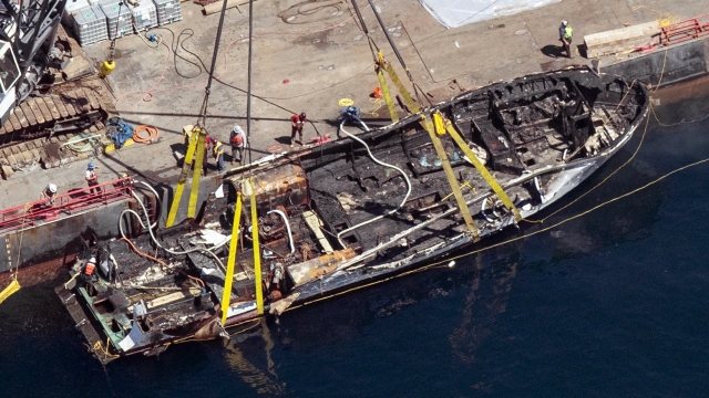 The burned hull of the dive boat Conception is brought to the surface by a salvage team off Santa Cruz Island, Calif.