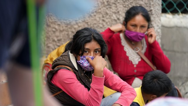 Two women seeking asylum in the U.S. wait in Matamoros, Mexico.