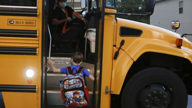 Child boards school bus in Georgia