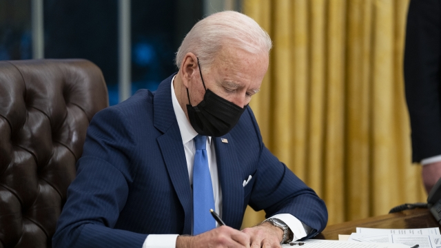 President Joe Biden signs an executive order on immigration.