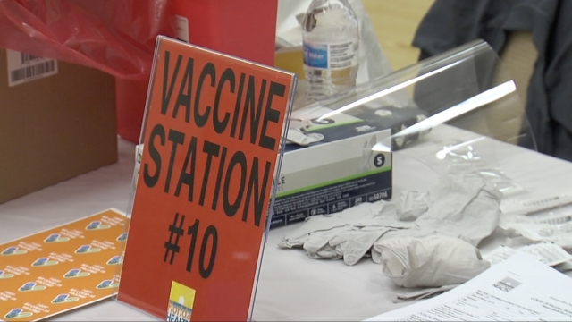 Sign shows people where to get vaccinated.