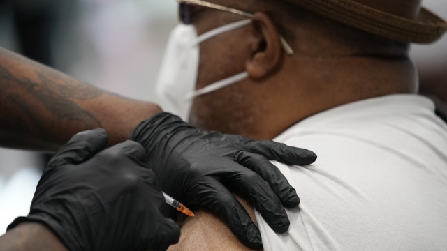 A man receives his COVID-19 vaccine