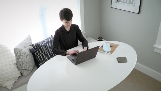 Teen works on a computer