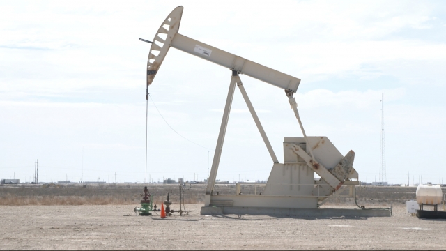 An oil well in a field.