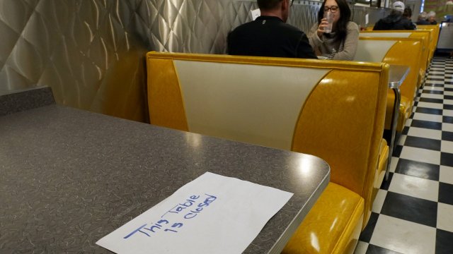 Socially-distanced diners in a California restaurant