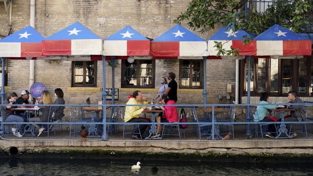 Diners eat at a restaurant on the River Walk in San Antonio, Texas