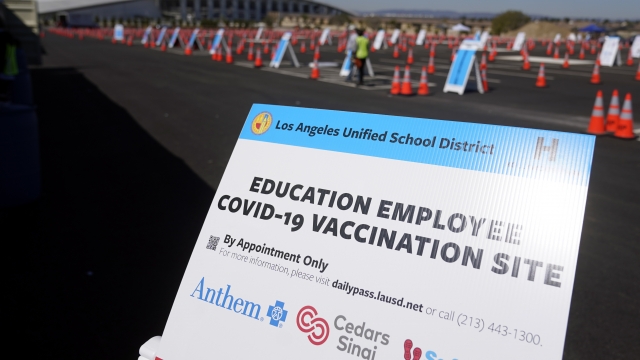 A sign is placed at a COVID-19 vaccination site for employees of the Los Angeles school district.