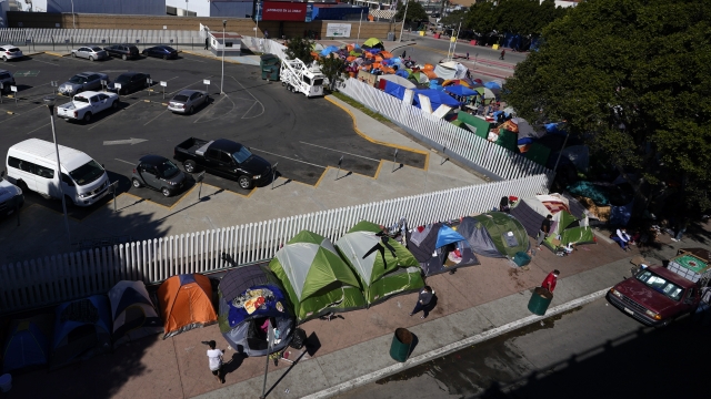Tents used by migrants seeking asylum in the United States line an entrance to the border crossing in Mexico.