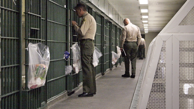Los Angeles County Sheriff's deputies inspect a cell block at the Men's Central Jail in downtown Los Angeles.