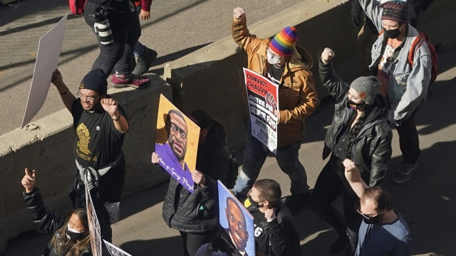 Demonstrators march through downtown Minneapolis following protests near the Hennepin County Government Center