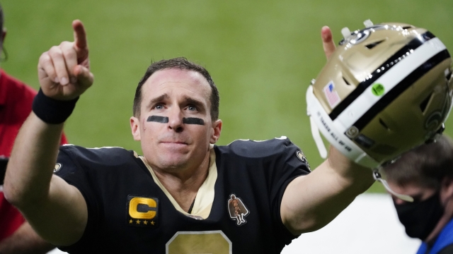 New Orleans Saints quarterback Drew Brees gestures to his family and fans after an NFL divisional round playoff game.