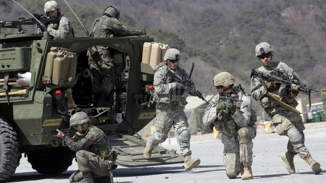 U.S. Army soldiers and South Korean soldiers take their positions during a demonstration.