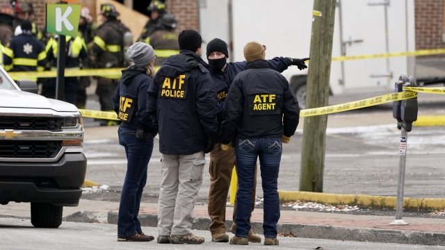 Emergency personnel work near the scene of an explosion in downtown Nashville, Tenn., Dec. 25, 2020.