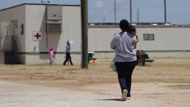Woman with child at ICE facility